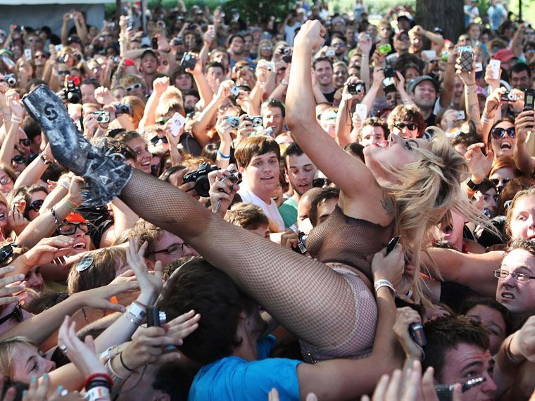 Naked crowd surfing.