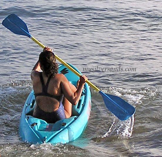 women kayaking on water