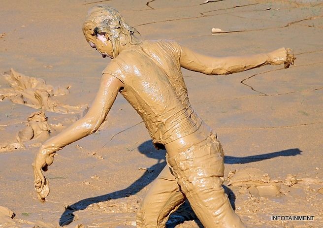 women in deep mud