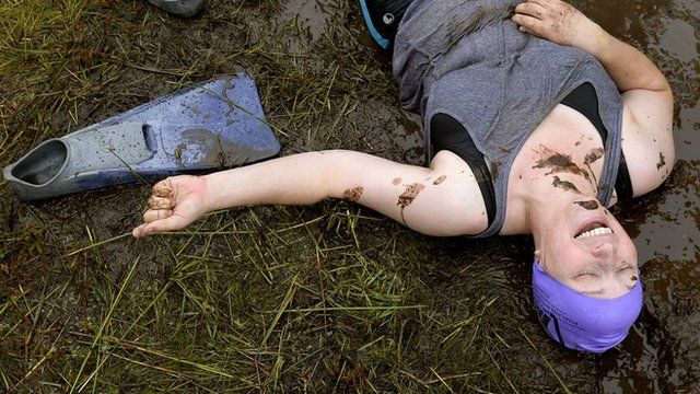 women thrown into mud