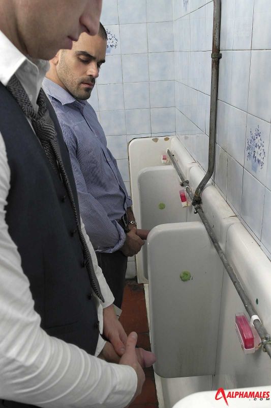 men using toilet together