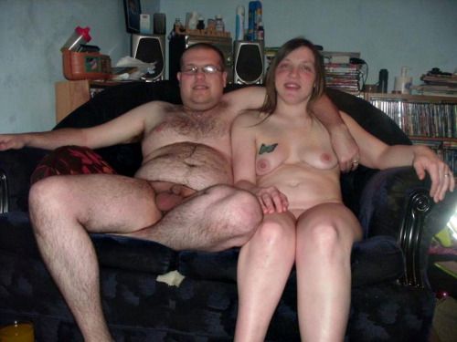 naked couple on couch watching tv