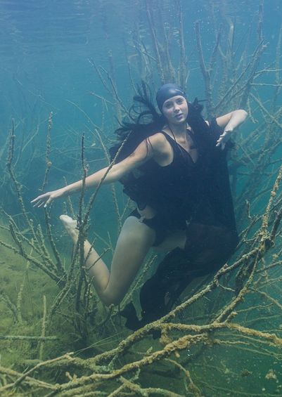 woman holding their breath underwater