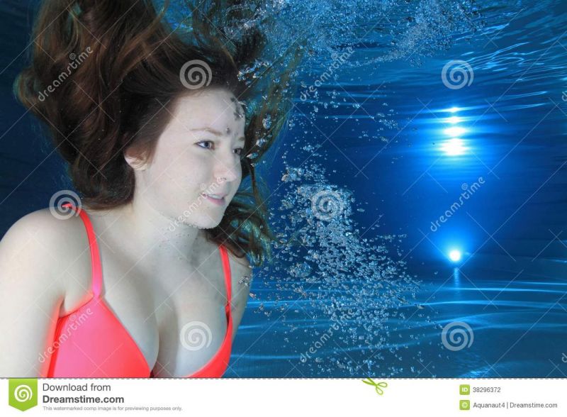 female swimming underwater side view