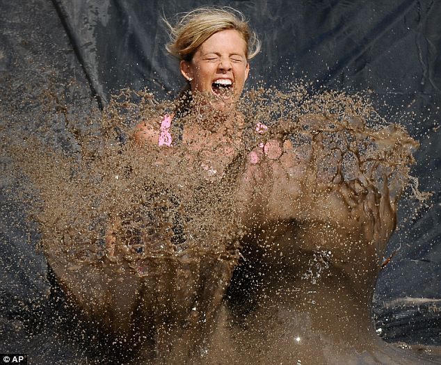 women pushed into mud