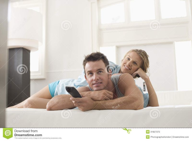 senior couple watching television