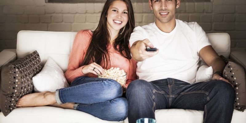 couple on couch watching tv