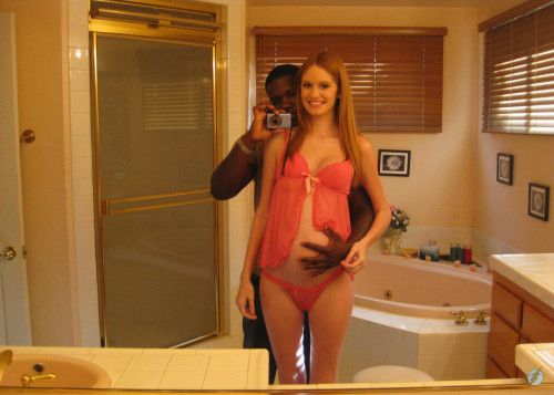 interracial pregnant couple posing