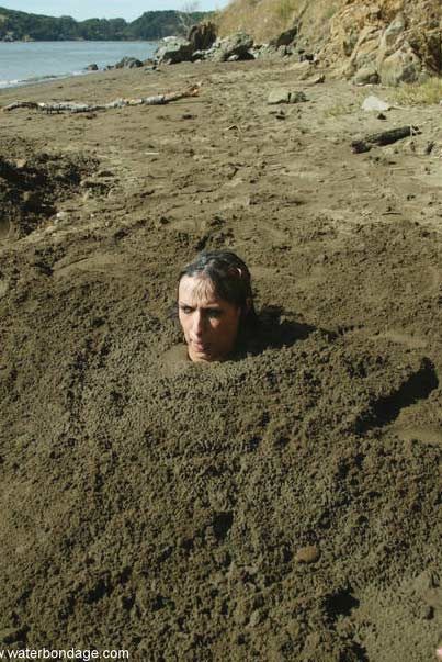 person buried in sand
