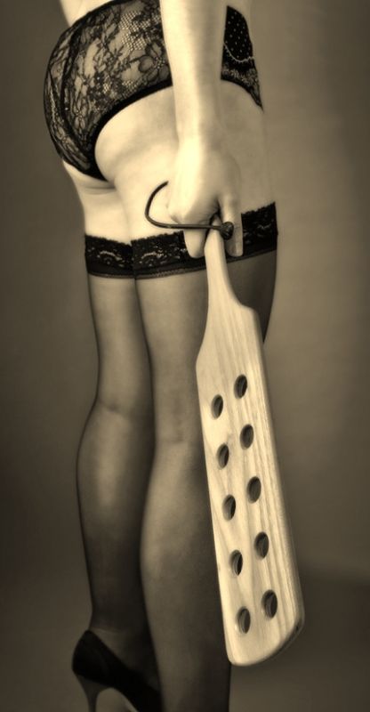 woman with spanking paddle