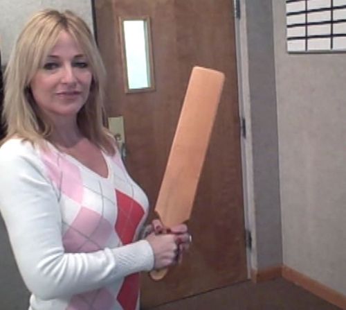 standing with spanking paddle