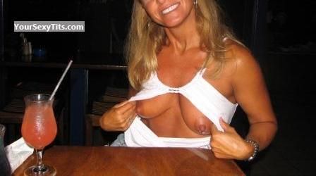 mature wife flashing tits