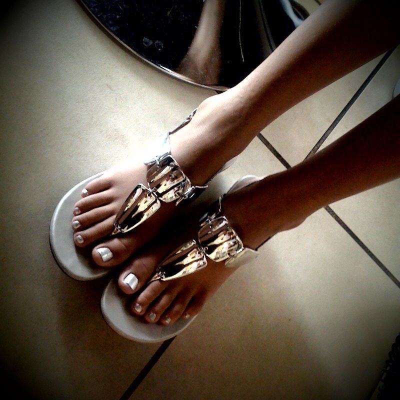 women toenails gold black polish