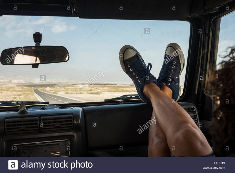 beautiful hitchhiker feet on dashboard