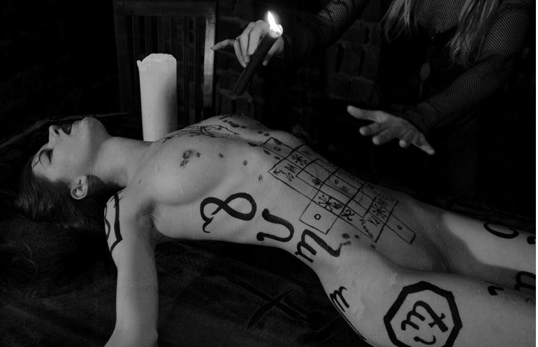 naked human sacrifice on altar