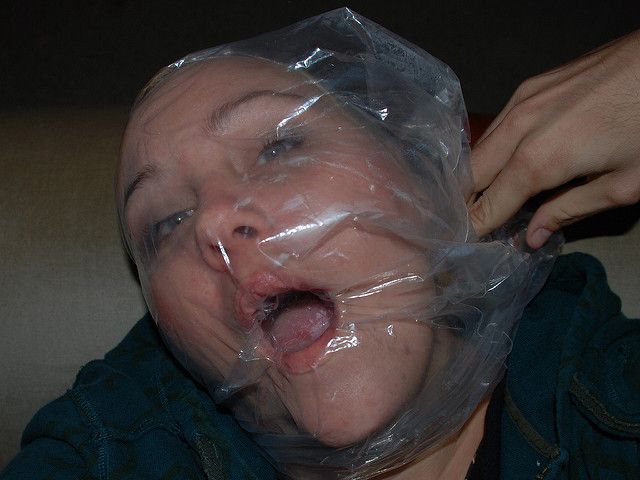 struggling woman suffocated with bag