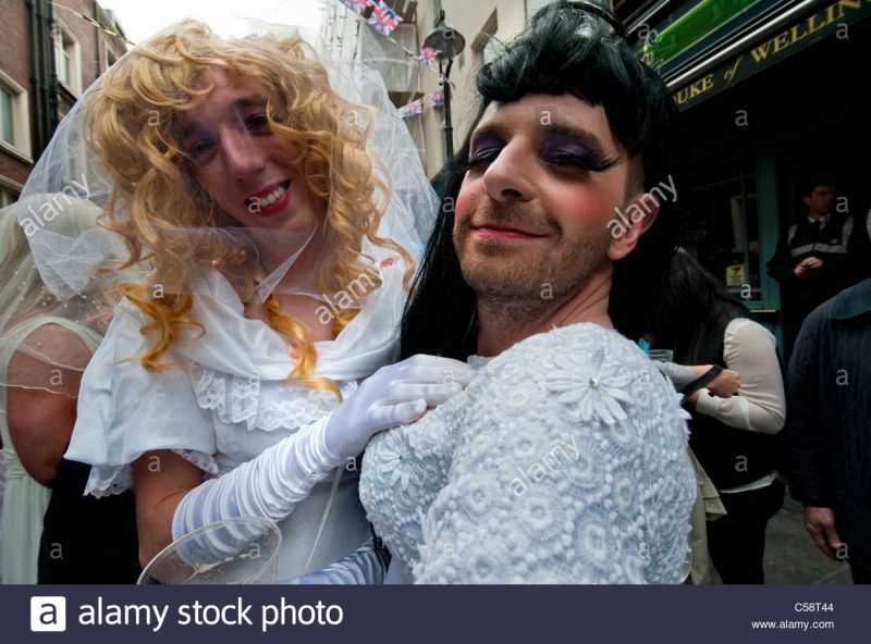 men dressed as women at a wedding
