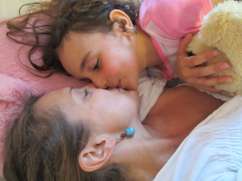 mom and daughter deep kissing