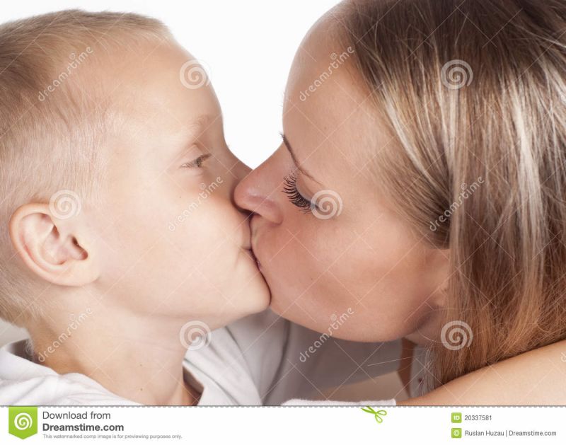 mother daughter kissing in bed
