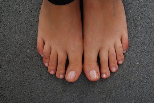 bare feet on concrete