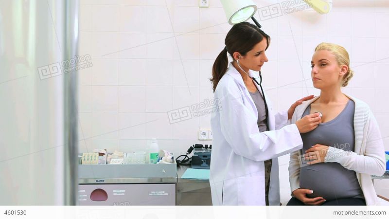 doctor examining pregnant