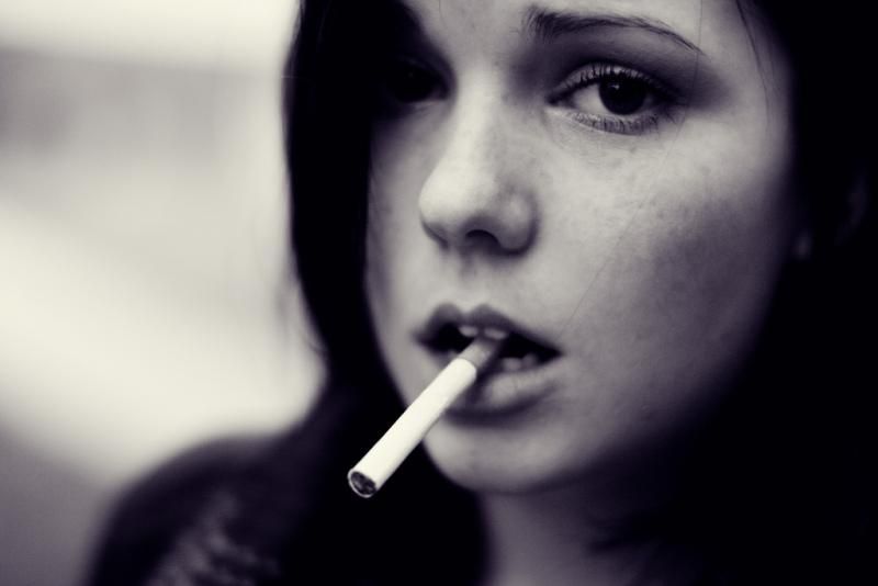 full face woman dangling cigarette