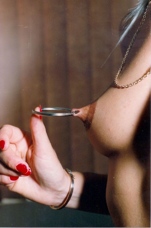 female stretched nipple piercing