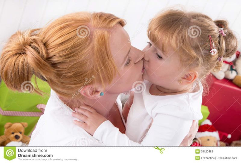 mom kissing teen daughter