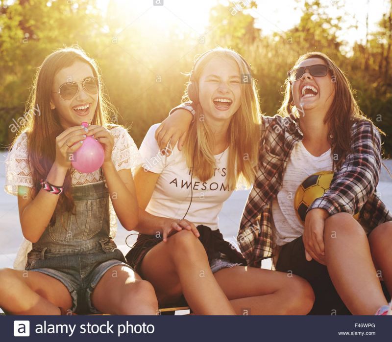 satisfied group women laughing mocking
