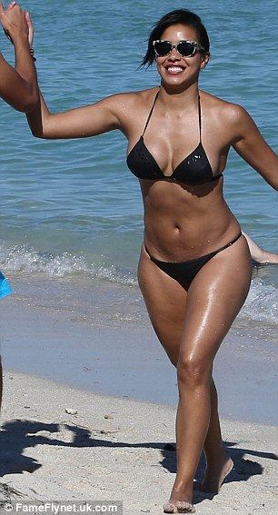 girl taking off bikini