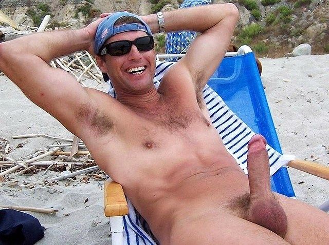 funny dude pops a boner on beach