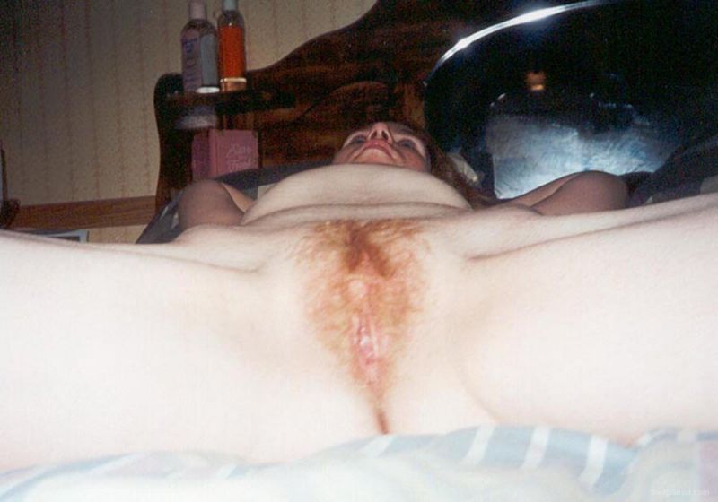 hairy cougar spread legs on bed