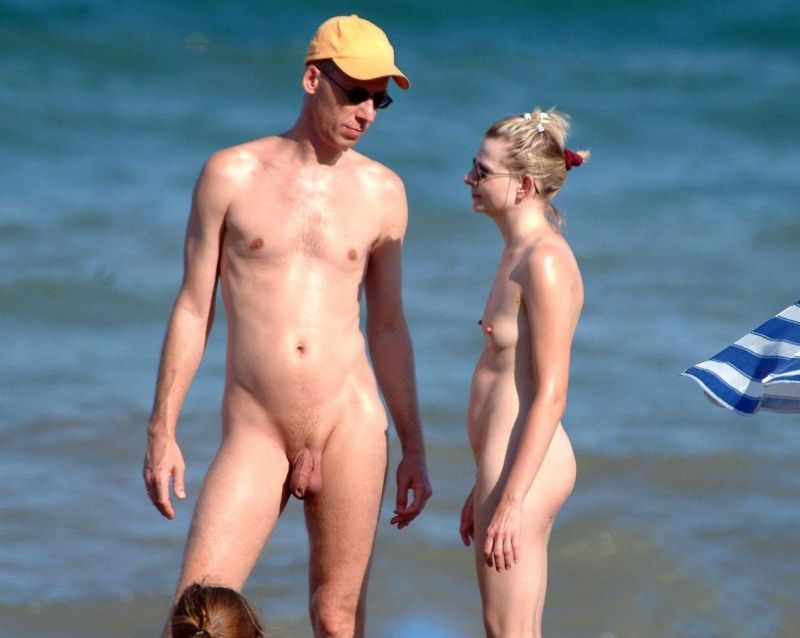 nude couple having sex on beach