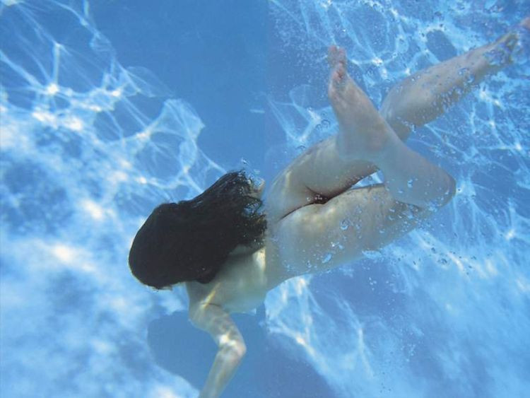 nude underwater couple