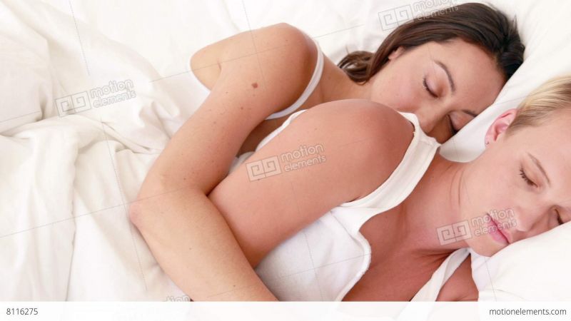 people cuddling in bed