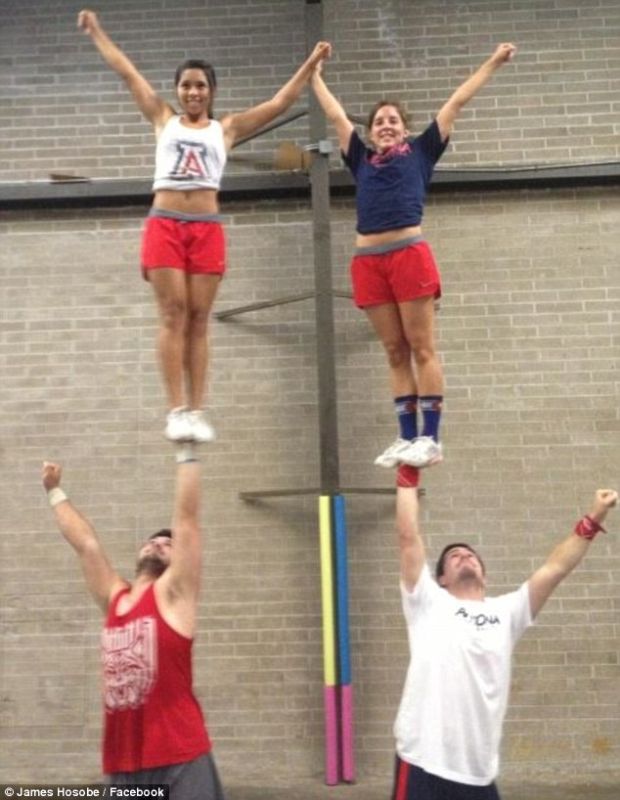 male cheerleader stunts flyers
