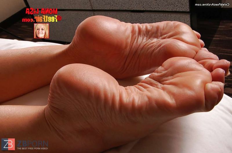 brown women feet with cyan toenails
