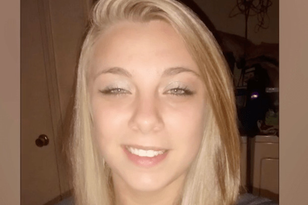 girl holding head