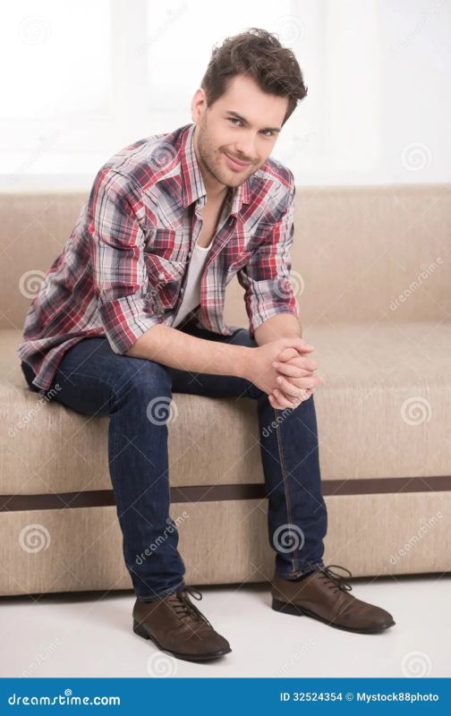 two men sitting arm and arm