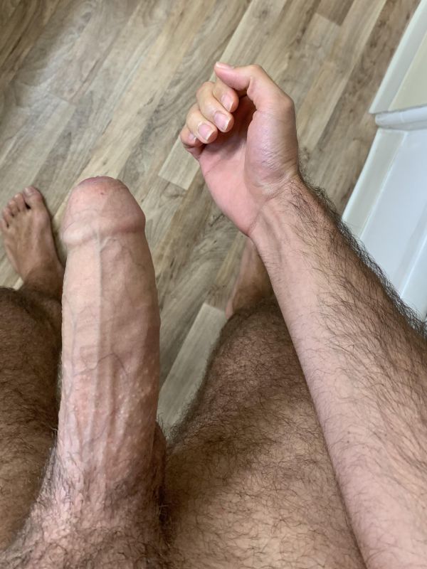 man jerking off uncut cock