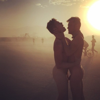 man naked in front of women