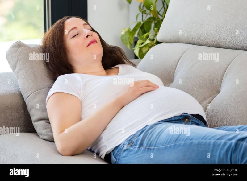woman asleep on couch