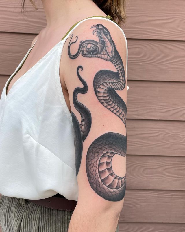 full black arm tattoo