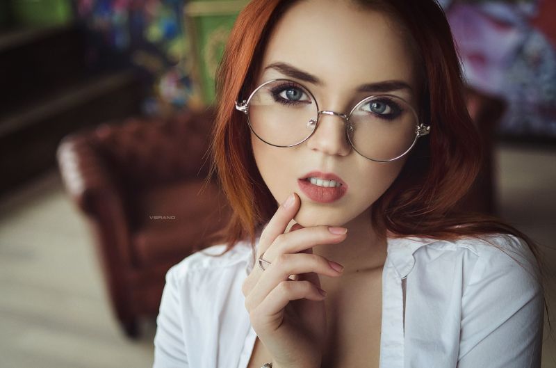mature redhead wearing glasses